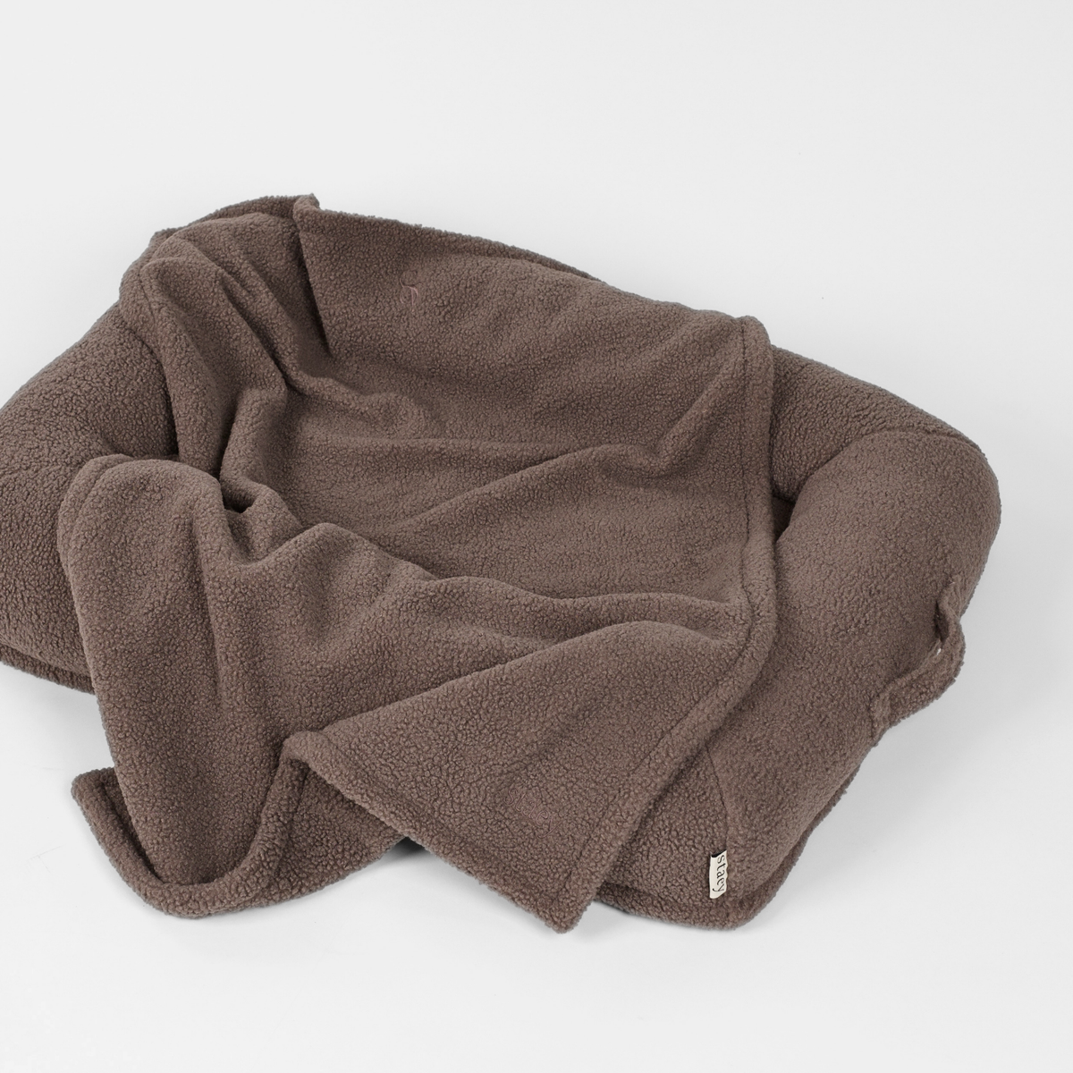 The taupe teddy dog blanket loosely folded